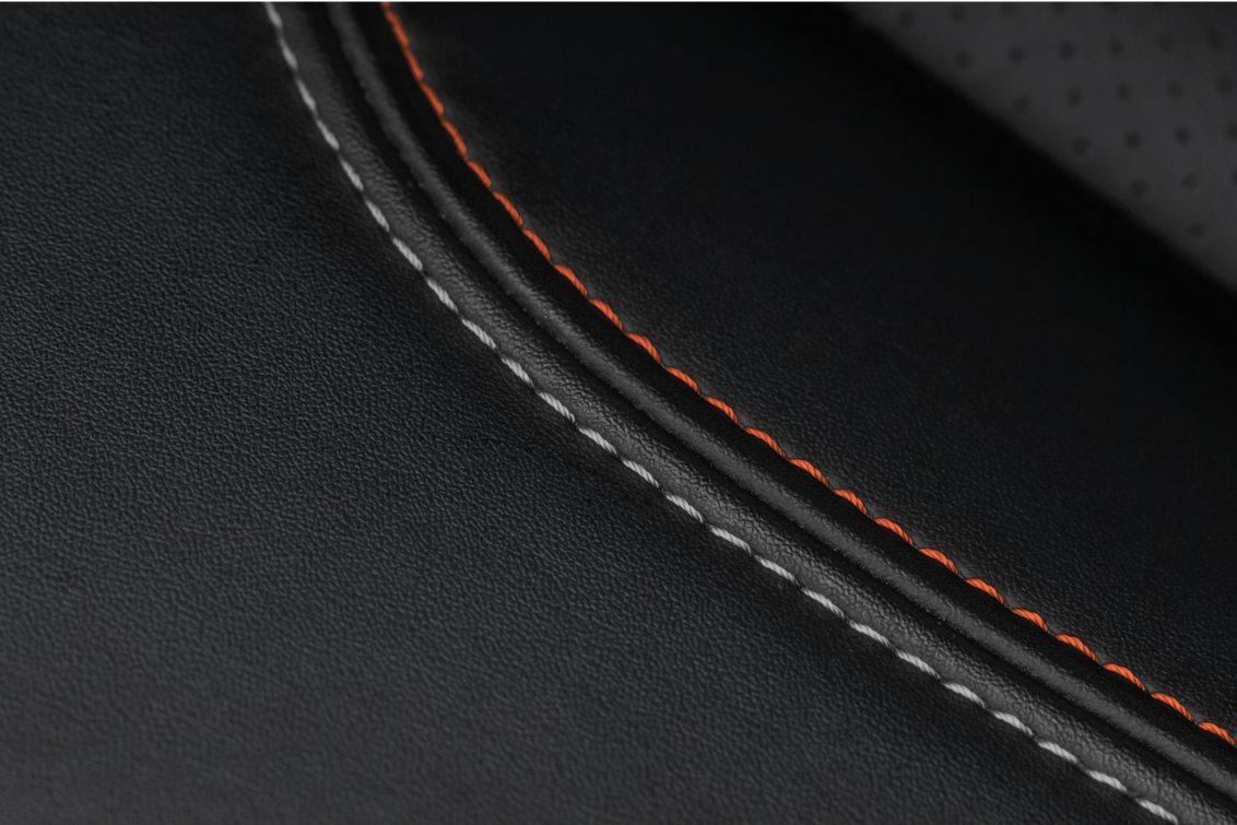 Black leather with orange and white stitches