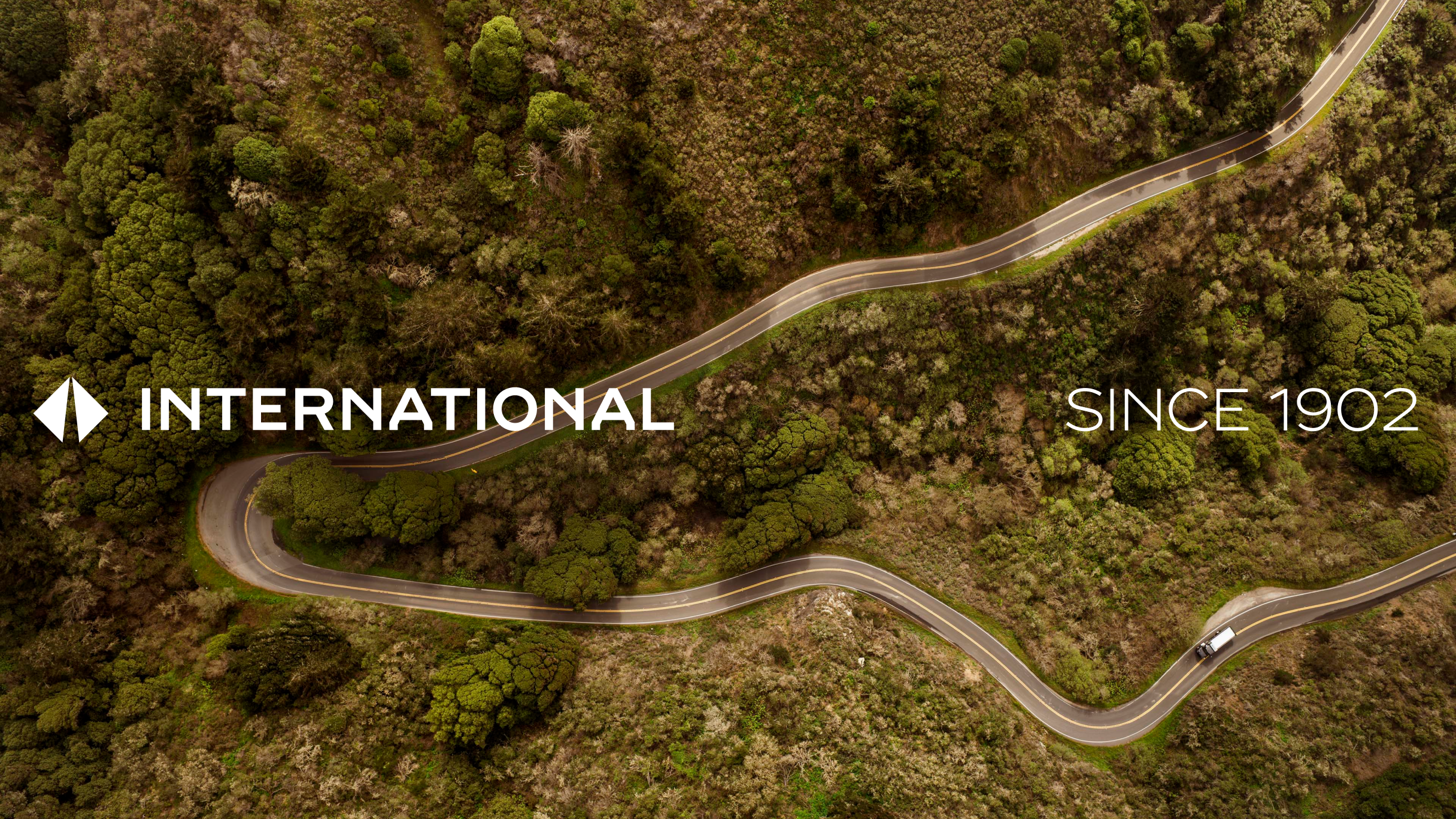 Bird's eye view of a truck on a winding road