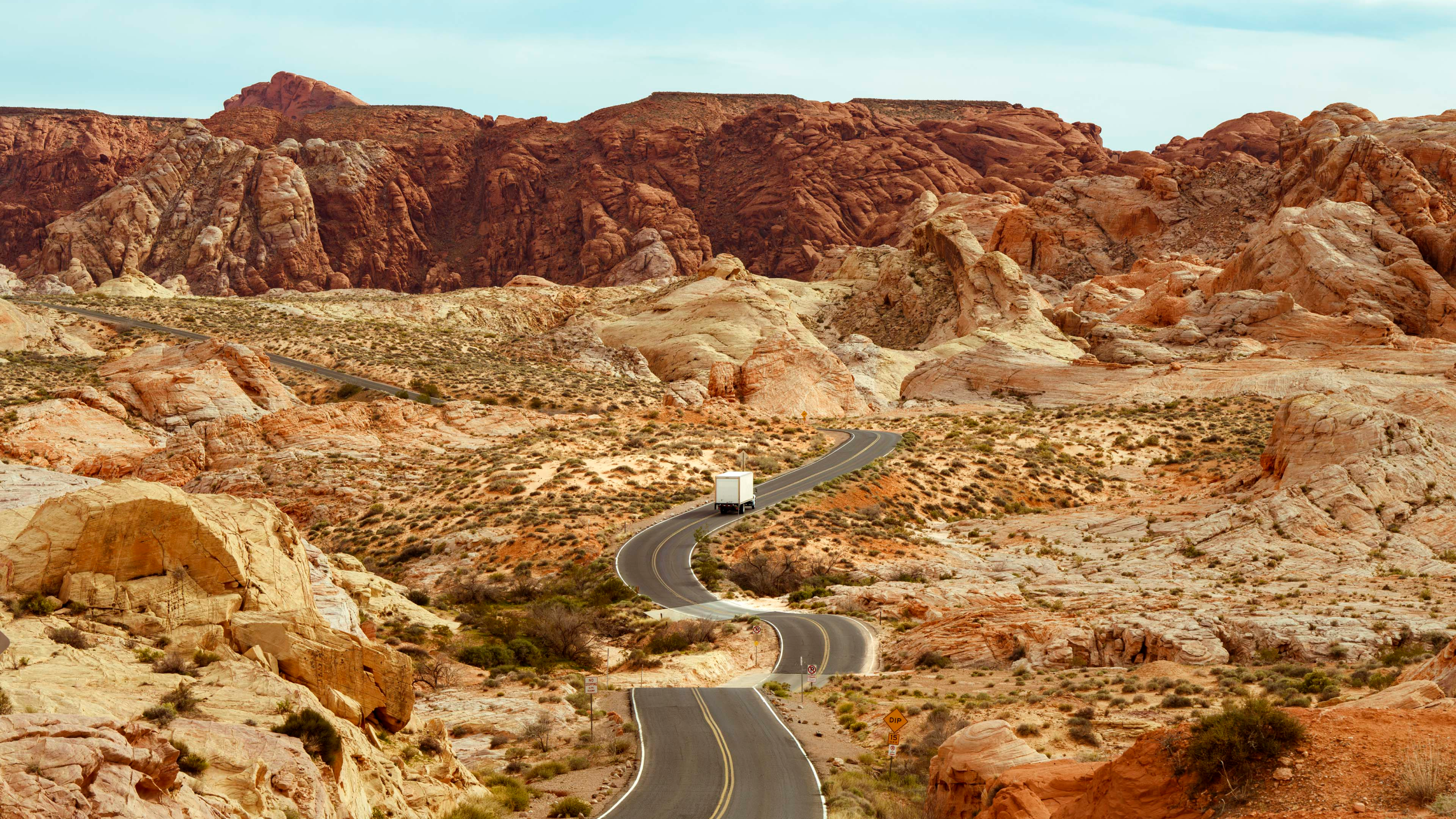 Truck driving through rocky landscape