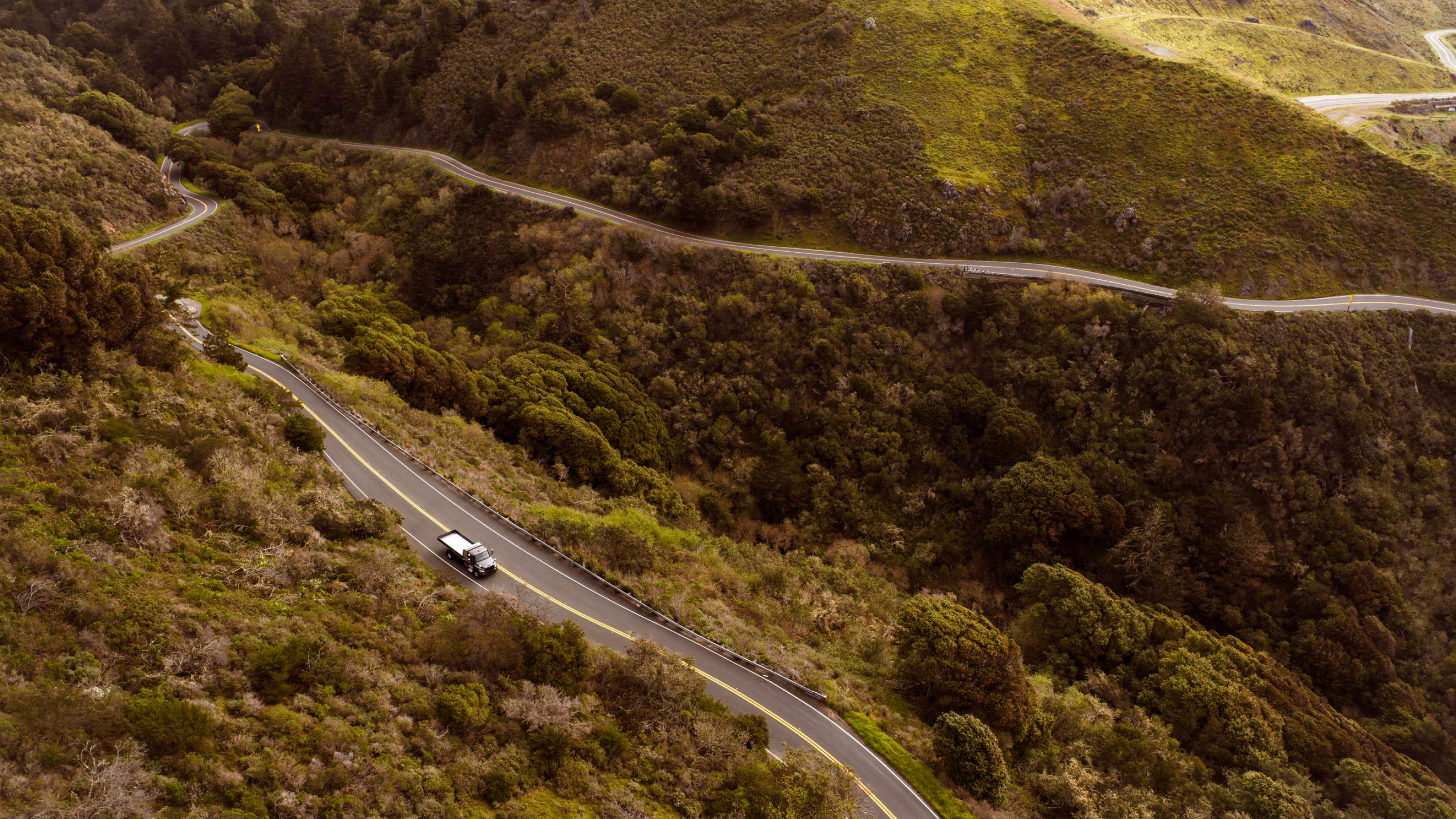 Truck winding its way up a mountain