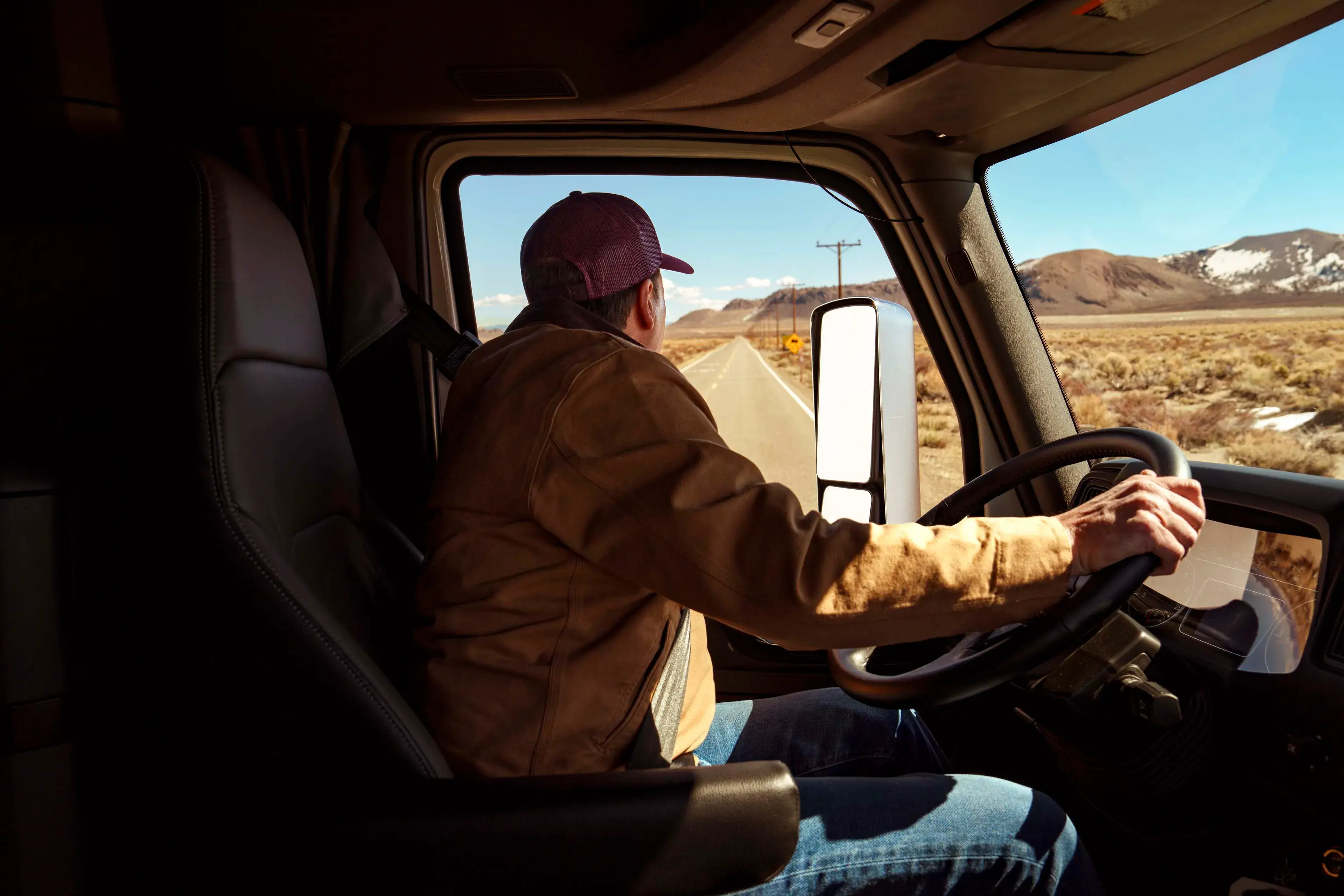 International driver in cab on road